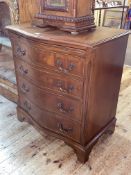 Mahogany serpentine front chest having brush slide above four long drawers on bracket feet,