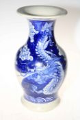 Large blue and white vase decorated with mythical dragon and floral design, 30cm high.