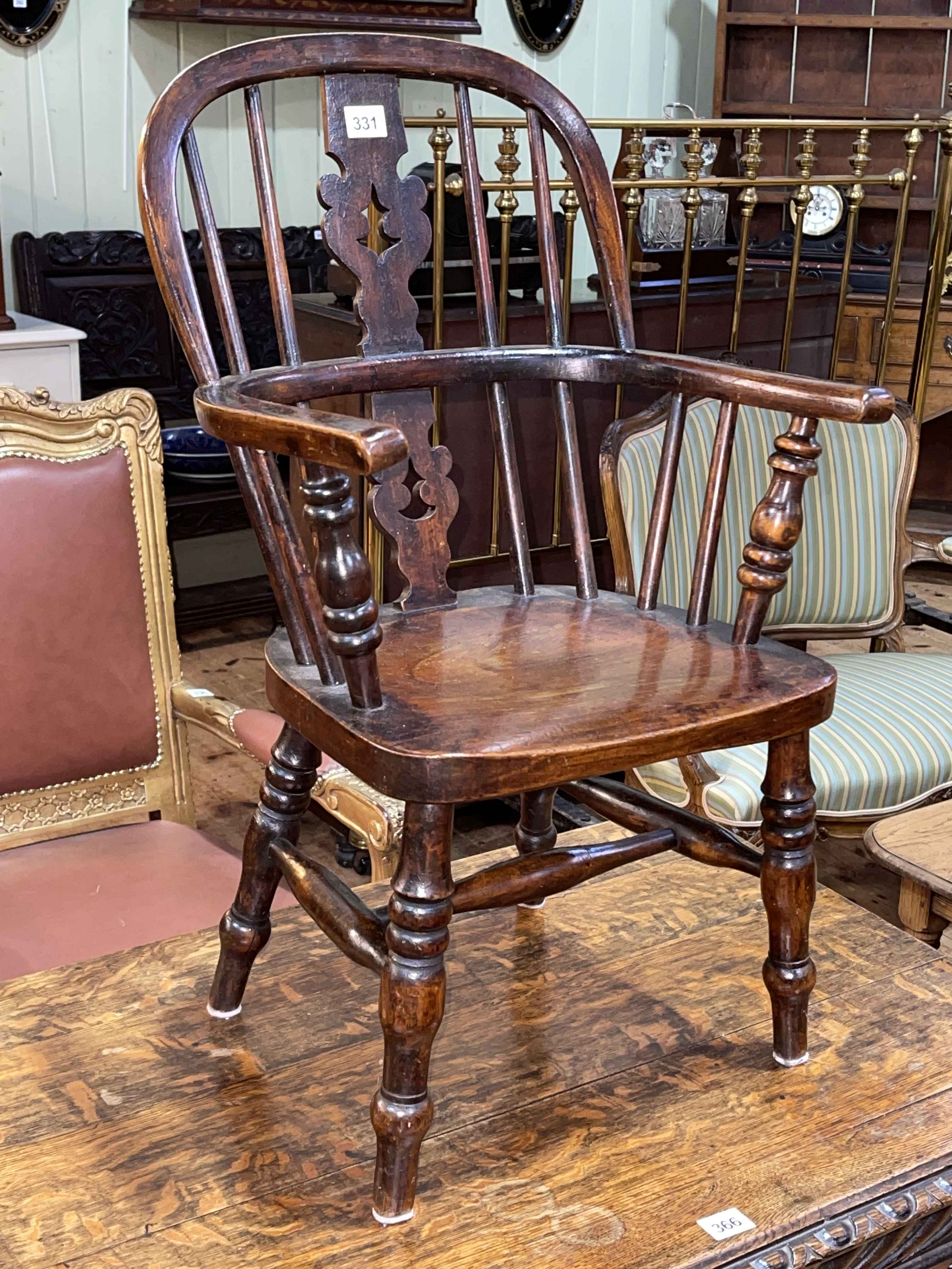 Victorian child's Windsor pierced splat back armchair.