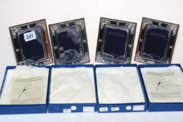 Set of four hallmarked sterling silver R. Carr photograph frames, boxed.