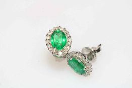 Pair of 18 carat white gold, emerald and diamond cluster earrings, emerald approx 1.