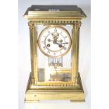 Gilt brass mantel clock having ornate case and enamel dial, 30cm high.