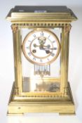 Gilt brass mantel clock having ornate case and enamel dial, 30cm high.