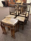 Set of four oak bobbin leg dining chairs and nest of three walnut tables on ball and claw legs.