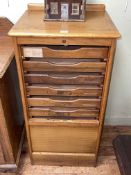 Early 20th Century oak tambour front filing cabinet, 97cm by 48cm by 41cm.