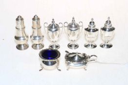 Three pairs of silver salt and pepper, silver mustard pot and open salt.
