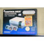 Nintendo Nes console with two controllers, in box.