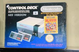Nintendo Nes console with two controllers, in box.