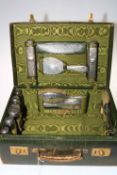 Edwardian Gentleman's toilet travelling case containing silver topped bottle,