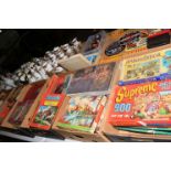 Seven boxes of vintage jigsaw puzzles.