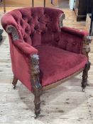 Victorian oak carved framed tub chair in wine buttoned draylon.