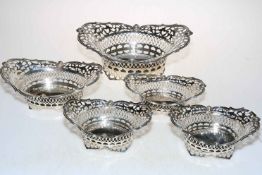 Collection of five Edwardian pierced and shaped silver baskets, London 1902, 1903 and 1905.