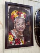 Framed hand made felt portrait of a lady in African dress, 86cm by 58cm including frame.