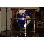 Semi-precious stone terrestrial globe and on four legged stand with centralised compass with box.