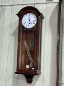 Comitti of London dome topped mahogany cased wall clock.