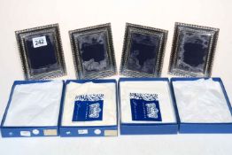 Set of four hallmarked sterling silver photograph frames, boxed.