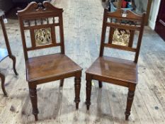 Pair Victorian hall chairs with inset Minton? tile backs.