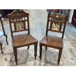 Pair Victorian hall chairs with inset Minton? tile backs.