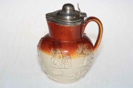 Antique silver topped stoneware jug with relief decoration, 19cm.