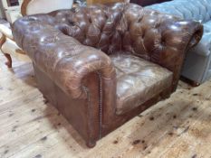 Halo brown deep buttoned and studded leather Chesterfield armchair.