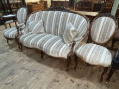 Victorian French rosewood three piece suite comprising double serpentine front settee,