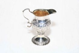 George III embossed silver cream jug, London 1778 by Nathaniel Appleton and Ann Smith.