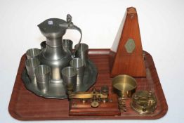 Baehler pewter jug, eight beakers and tray, metronome, and brass sextant.