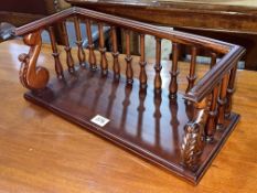 Mahogany table book rack, 16.5cm by 43cm by 19cm.