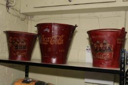 Three buckets marked 'Coca Cola'.