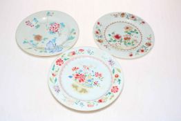 Three 18th Century Chinese pottery famille rose plates, 23cm diameter.