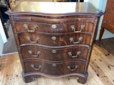 Mahogany serpentine front Bachelors chest having brush slide above four long drawers on shaped