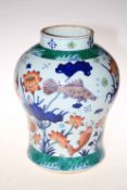 Large Chinese vase of bulbous form decorated with fish and marine fauna, square mark to base, 34cm.