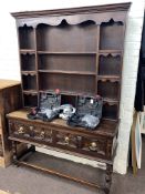 Jacobean style oak shelf back dresser, 198cm by 137cm by 45cm.