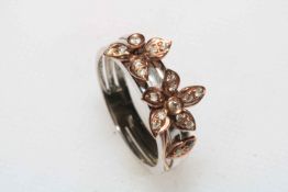 Flower design nineteen stone diamond cluster ring set in 9 carat yellow gold, size L.