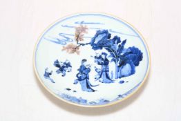 Chinese blue and white saucer dish decorated with figures in garden, four character mark to base,