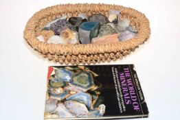 Basket of assorted minerals including Jade and related book.