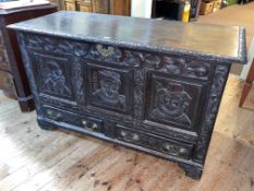 Antique carved oak two drawer kist having three panels carved with notable 16th Century figures,
