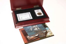 El Cazador 8 Reales silver coin by The Morgan Mint with NGC Shipwreck certification and box.