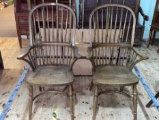 Pair Windsor spindle back elbow chairs with crinoline stretchers.