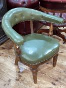 Victorian oak and green leather club chair.