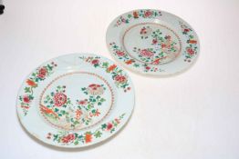 Pair of large 18th Century Chinese pottery plates with famille rose decoration, 31cm diameter.