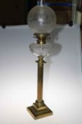 Victorian brass columned oil lamp with etched glass shade, 90cm high.