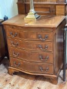 Mahogany serpentine front chest having brush slide above four long drawers on bracket feet,