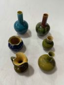 Collection of five small Linthorpe pieces and unmarked turquoise vase, tallest 12.5cm.