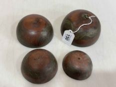 Four Chinese metal graduated bells/covers.