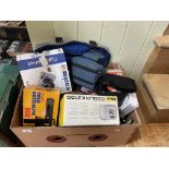 Box of various cameras and accessories.