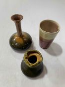 Three pieces of Linthorpe Chrs. Dresser: beaker no. 63, vase no. 13, 15.5cm, and small vase.