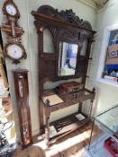 Victorian carved oak mirror back hallstand, 218cm by 122.5cm by 32.5cm.