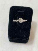 Solitaire diamond (approx 0.75 carat), platinum and 18 carat white gold ring, size R.