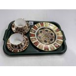 Royal Crown Derby Imari plate, 27cm, and two cups and saucers.